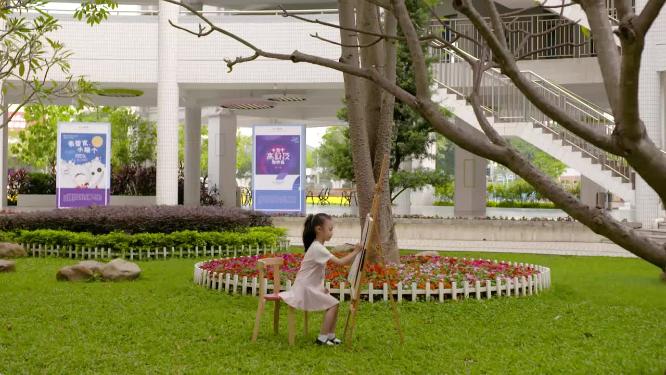 可爱小女孩户外画画