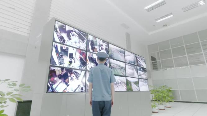 高速公路路网指挥中心监控画面执法人员背影
