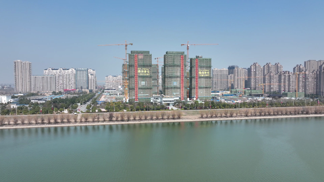 航拍城市江景房建筑工地