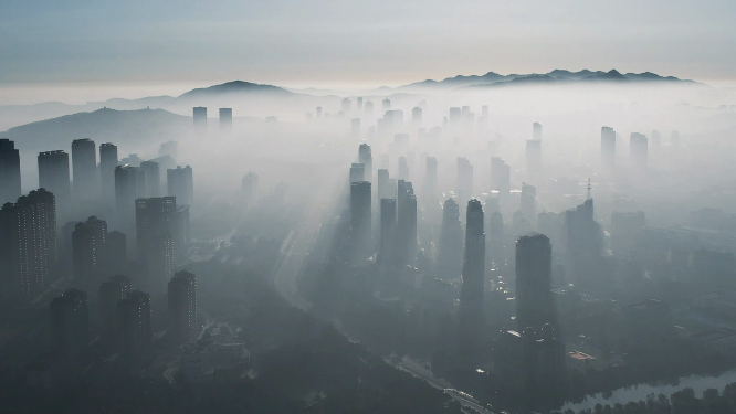 航拍云雾之中的威海高新区水墨城市
