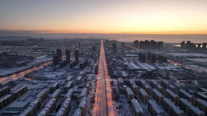 航拍山东荣成雪后的城市黎明美景
