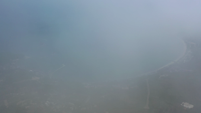 航拍视角穿过云雾看到广西涠洲岛海景