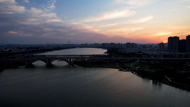 航拍河南洛阳夕阳下的城市建筑