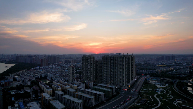 航拍河南洛阳夕阳下的城市建筑