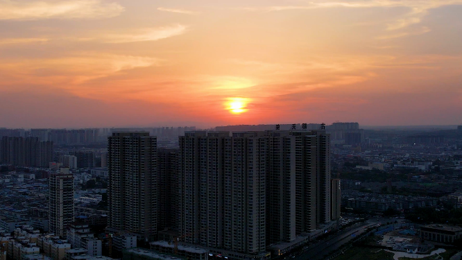 航拍河南洛阳夕阳下的城市建筑