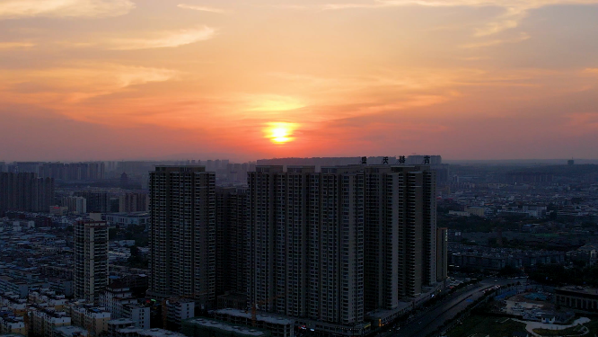 航拍河南洛阳夕阳下的城市建筑