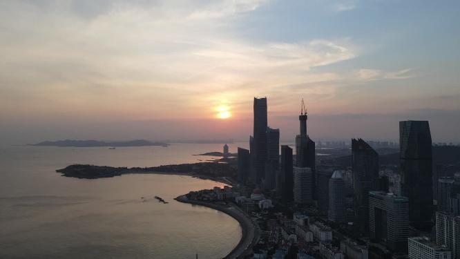 航拍海边城市青岛日落晚霞