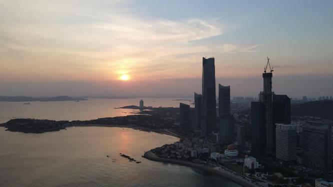 航拍海边城市青岛日落晚霞