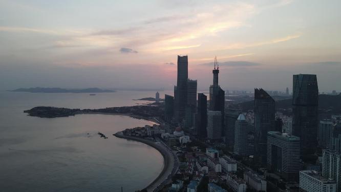 航拍海边城市青岛日落晚霞