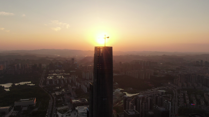 城市航拍商务建筑吊塔日落晚霞