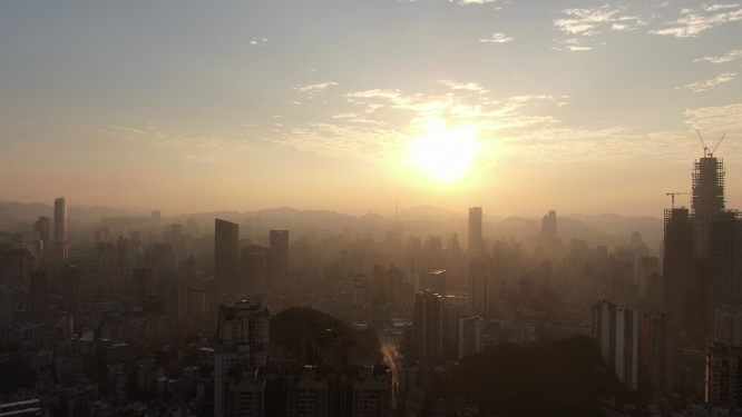城市航拍城市高楼吊塔日出彩霞