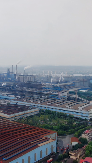 航拍城市工业生产工厂炊烟
