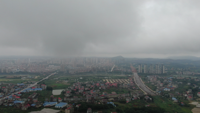航拍城市暴雨来临雨季