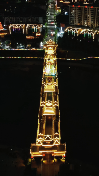 侗族特色建筑风雨桥鼓楼夜景竖屏
