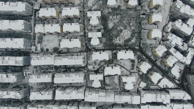 航拍城市住宅小区冬天雪景