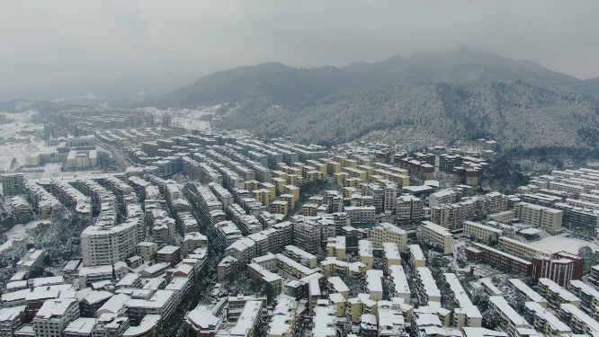 航拍城市住宅小区冬天雪景