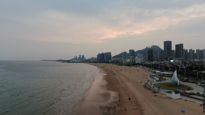 航拍青岛海边日落晚霞