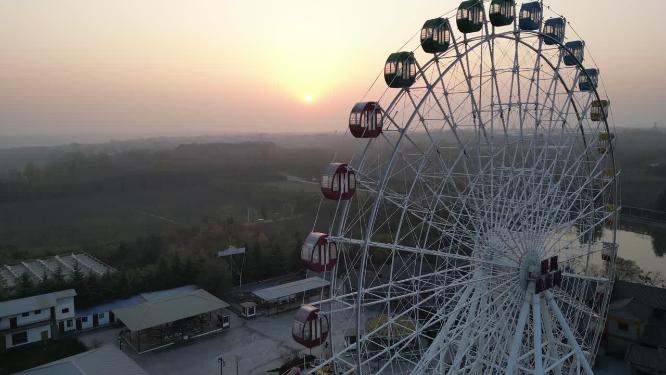 夕阳景区摩天轮秦风欢乐谷游乐场玩乐航拍