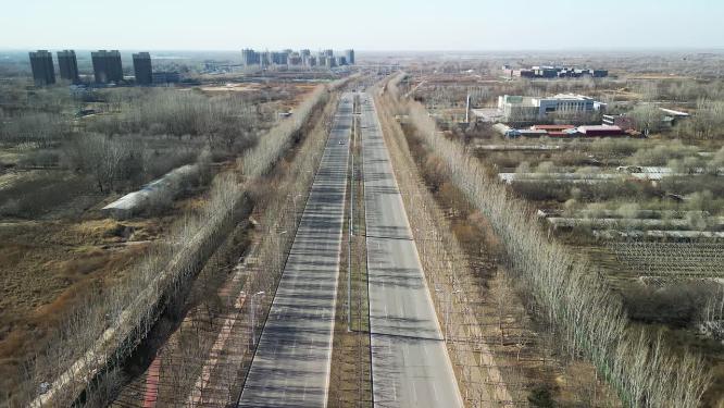 4K航拍北方冬天公路行道树自然景观