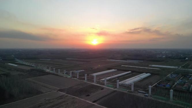 4K北方冬天建设中的高架桥与夕阳日落