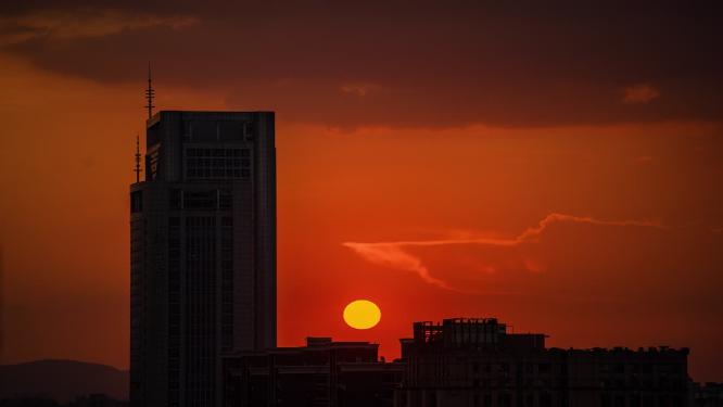 4k城市大楼太阳特写日落晚霞延时