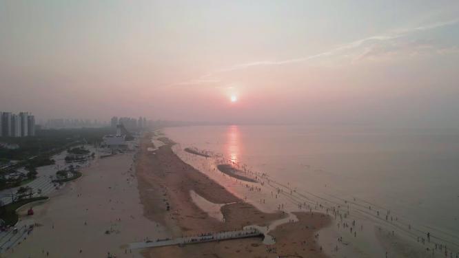 4k航拍山东烟台经济开发区金沙滩日落