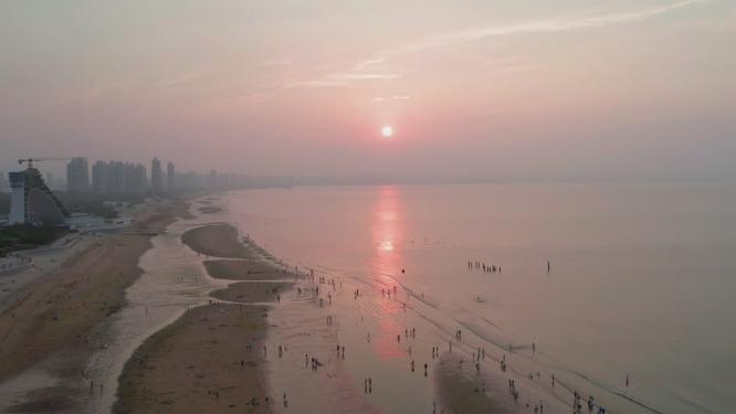 4k航拍山东烟台经济开发区金沙滩日落