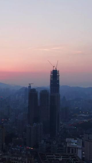 航拍城市清晨日出彩霞迷雾