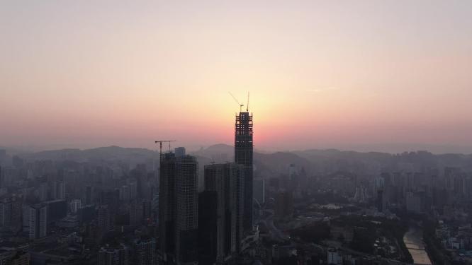 航拍城市高楼吊塔日出