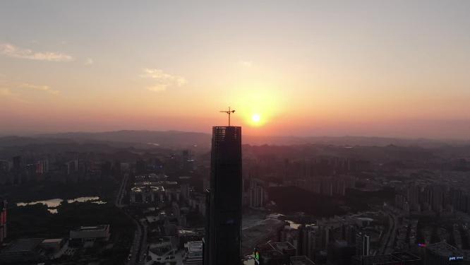 航拍城市高楼吊塔日落